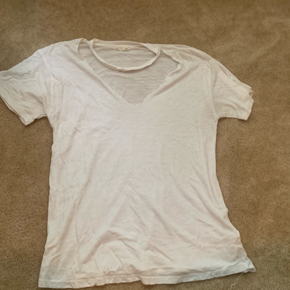 Distressed neckline white v-neck.